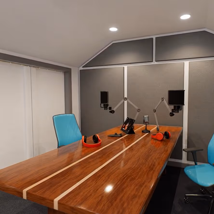 A microphone and mixing desk inside a Crafter’s Connection shed fitted out as a podcast studio